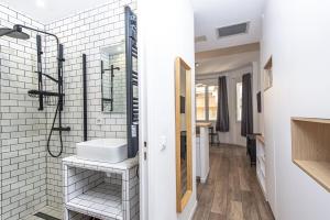 a bathroom with a sink and a mirror at Palais athenea in Beausoleil +14 photos