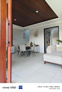a living room with a couch and a table at villa Nusantara ungasan in Uluwatu