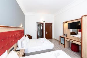 TV a/nebo společenská místnost v ubytování Olimpic Hotel