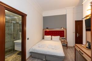 Postel nebo postele na pokoji v ubytování Olimpic Hotel
