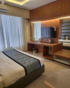 Postel nebo postele na pokoji v ubytování Hotel Sai D-lax