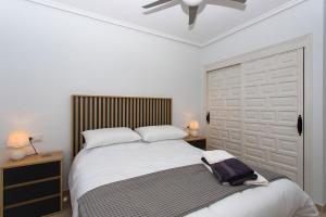 a bedroom with a bed and a ceiling fan at CH Villa Aguila Ciudad Quesada in Ciudad Quesada +30 photos