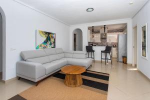 a living room with a couch and a table at CH Villa Aguila Ciudad Quesada in Ciudad Quesada
