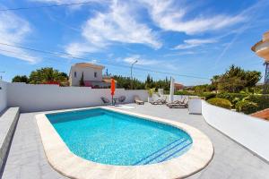 a swimming pool in the middle of a patio at CH Villa Aguila Ciudad Quesada in Ciudad Quesada