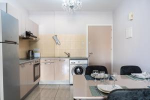 a kitchen with a table with a dining room at Carisa flat, 2 bedrooms in Larnaca