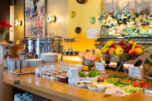 a buffet with a lot of food on a table at Hôtel Hor Europe in Paris