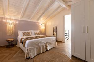 Katil atau katil-katil dalam bilik di Villa delle Palme con piscina privata