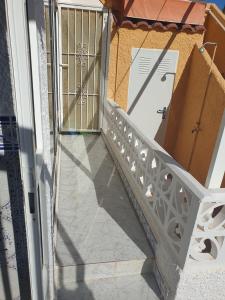 an open door with boxes on a balcony at Coqueto alojamiento en Los Alcázares in Los Alcázares