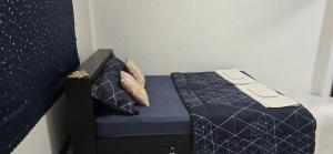 Ένα ή περισσότερα κρεβάτια σε δωμάτιο στο บ้านสุขใจ Baan Sukjai