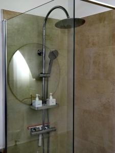 a shower with a shower head in a bathroom at C'era una volta in Modugno