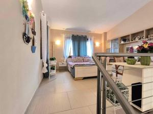 a living room with a bed in a room at Villa Bettina in Olympiada