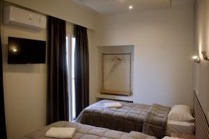 Postel nebo postele na pokoji v ubytování Nafsika Hotel Athens Centre