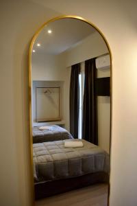 Postel nebo postele na pokoji v ubytování Nafsika Hotel Athens Centre