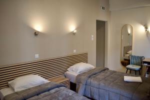 Postel nebo postele na pokoji v ubytování Nafsika Hotel Athens Centre