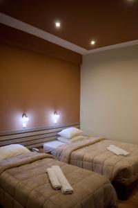 Postel nebo postele na pokoji v ubytování Nafsika Hotel Athens Centre
