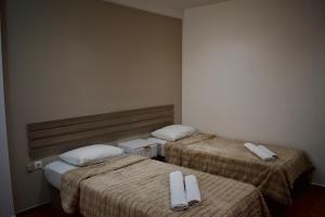 Postel nebo postele na pokoji v ubytování Nafsika Hotel Athens Centre