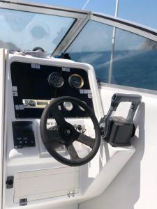 a steering wheel on the back of a boat at lancha deportiva stand by me in Rodadero