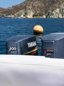 two boxes sitting on the side of a boat at lancha deportiva stand by me in Rodadero