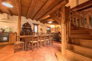 a kitchen and dining room with a table and chairs at Près de l'eglise in Garin