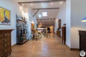 a hallway with a dining room and a dining table at Le volp in Le Plan