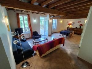 a living room with a couch and a table at Chantecler in Pibrac