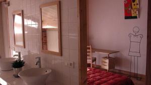 a bathroom with a sink and a mirror at Baugnac in Lavalette +19 photos