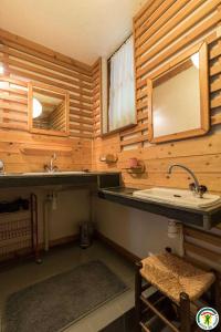 a bathroom with a sink and a mirror at Le gîte de la coume in Garin +38 photos