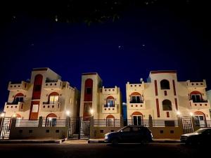 a building with a car parked in front of it at Anne 2 dahab in Dahab