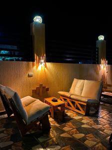 a living room with two chairs and a couch at Anne 2 dahab in Dahab +1 photo