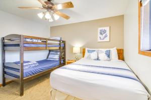 a bedroom with two bunk beds and a ceiling fan at Family-Friendly Condo 1 Mi to Silver Dollar City! in Branson West +27 photos