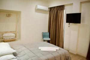 Postel nebo postele na pokoji v ubytování Nafsika Hotel Athens Centre