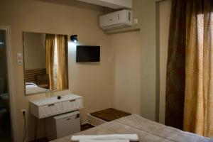 Postel nebo postele na pokoji v ubytování Nafsika Hotel Athens Centre