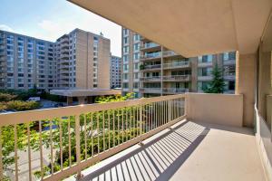 a balcony with a view of some buildings at Prime Location! Spacious & Comfy in Arlington