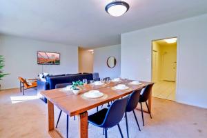 a dining room with a wooden table and chairs at Prime Location! Spacious & Comfy in Arlington