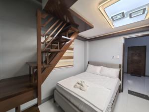 Postel nebo postele na pokoji v ubytování Yurich Hotel