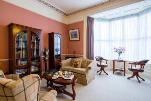 a living room with a couch and a table at Aberdeen Lodge in Dublin