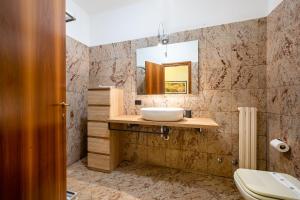 a bathroom with a sink and a mirror at Dimore Verona in Verona +289 photos