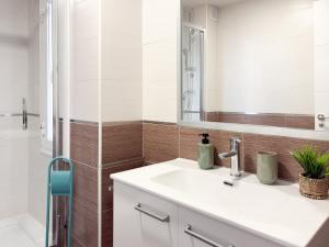 a bathroom with a sink and a mirror at ChillaHomes 102 in Candeleda +8 photos
