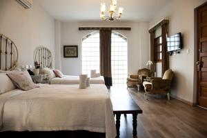 Postel nebo postele na pokoji v ubytování Hotel Don Alfonso