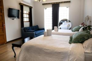 Postel nebo postele na pokoji v ubytování Hotel Don Alfonso