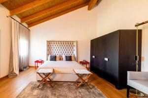 a bedroom with a large bed in a room at Homeby, Villa Corte dello Zanchino in Zola Predosa