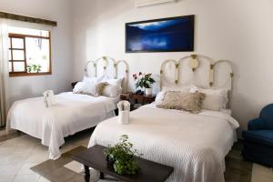 Postel nebo postele na pokoji v ubytování Hotel Don Alfonso