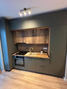 Køkken eller tekøkken på Queens by the sea