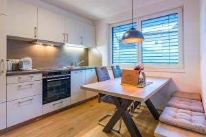 a kitchen with a table with a box on it at Apart Blasblei in Sankt Gallenkirch