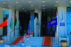 a group of flags in front of a building at Delmar Hotel Matrouh in Marsa Matruh