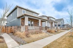 a house with a fence in front of it at 17 Mi to Denver Zoo Family-Friendly Aurora Home in Aurora