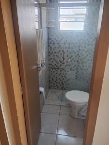 a bathroom with a toilet and a shower at Hostel Osoriense in Osório +38 photos