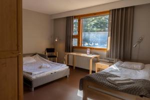 Ένα ή περισσότερα κρεβάτια σε δωμάτιο στο Kiipula Guest House