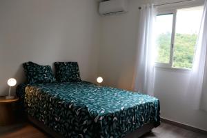 Postel nebo postele na pokoji v ubytování La Villa Gréviller