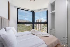 Ένα ή περισσότερα κρεβάτια σε δωμάτιο στο Torre Sakura by Leo Apartments +86 φωτογραφίες